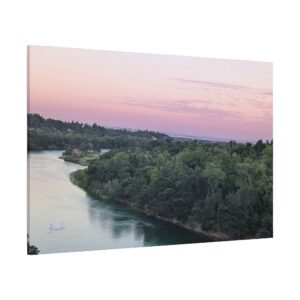 Fine art print of the Sacramento River at sunset, captured by Brenda Nakandi. Features tranquil afterglow skies in pink and gold tones, ideal wall decor for nature lovers and serene interior spaces